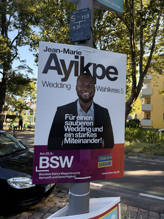 wahlplakat von jean-marie ayikpe für die abgeordnetenhauswahl 2026 mit der aufschrift: „für einen sauberen wedding und ein starkes miteinander“